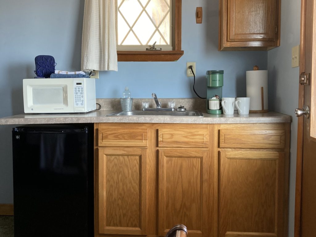 kitchenette with sink fridge microwave